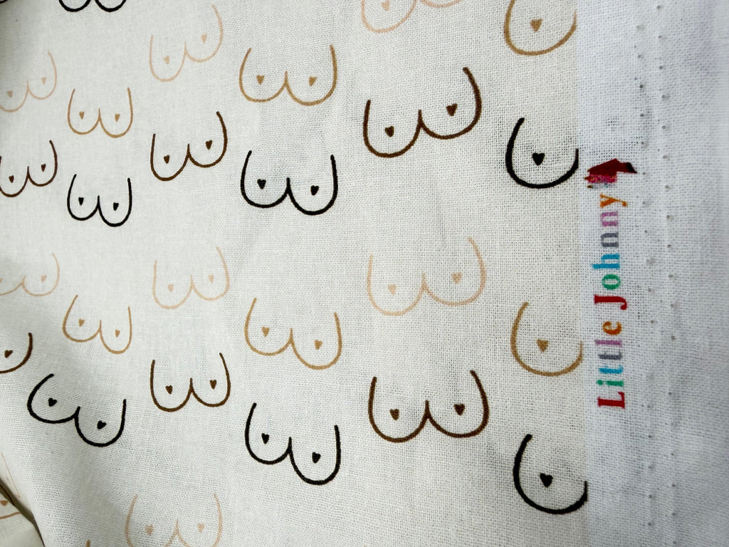 Fabric with nipple pattern and 'Little Johnny' branding.