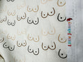Fabric with nipple pattern and 'Little Johnny' branding.