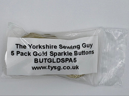 A clear plastic bag containing five small gold buttons, with a white paper label printed with the text 'The Yorkshire Sewing Guy 5 Pack Gold Sparkle Buttons BUTGLDPS5 www.tysg.co.uk