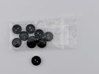 Dark Green plastic buttons, including one loose button and a clear plastic bag containing eight more, displayed on a light gray background.
