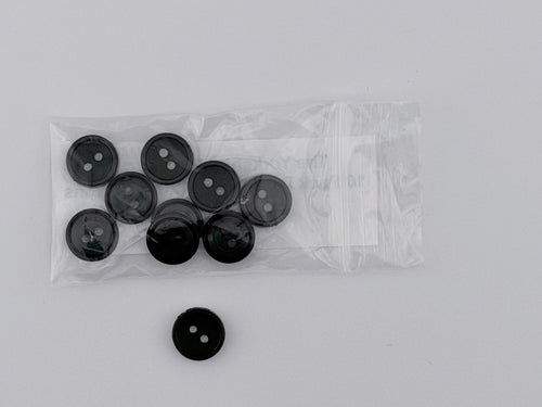 Dark Green plastic buttons, including one loose button and a clear plastic bag containing eight more, displayed on a light gray background.